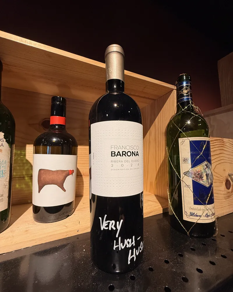 A bottle of Francisco Barona, Ribera del Duero, in a wooden crate at La Vid, with Victor’s note in white marker: “Very hush-hush”