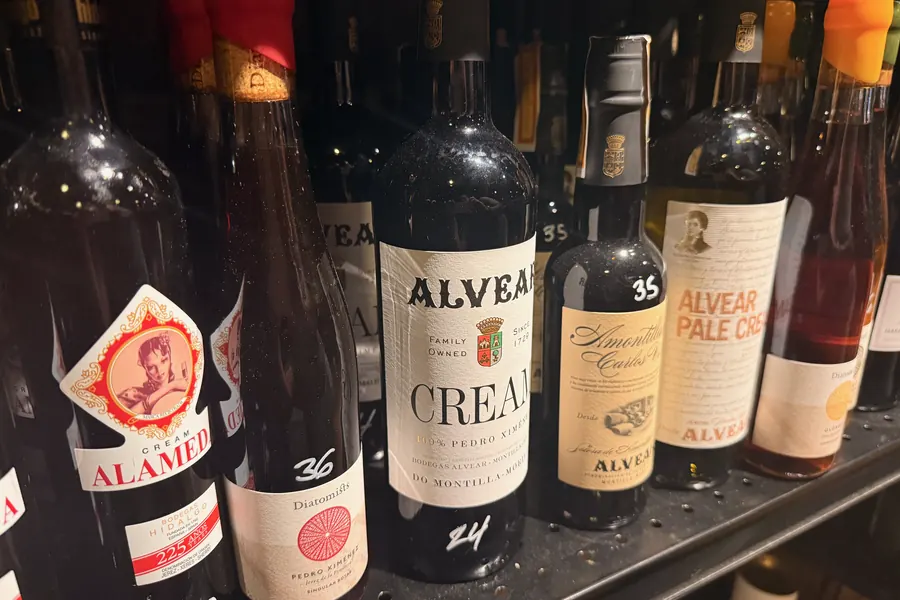 La Vid’s Montilla-Moriles shelf: Alvear Cream and Pale Cream, Alameda Cream, and other bottles with handwritten prices