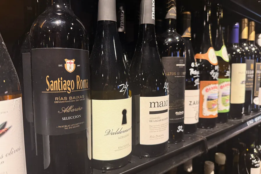 La Vid’s Rías Baixas shelf: Santiago Ruiz Albariño among a row of Galician whites with handwritten prices